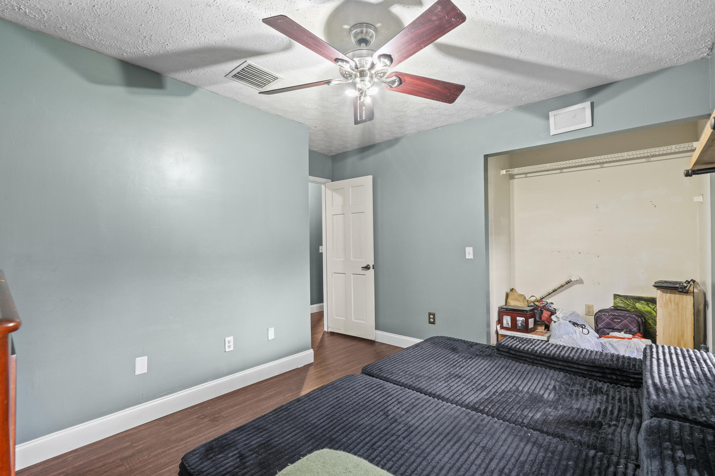 4170 McCarty Road Fort Pierce, FL 34945 - Photo 28 of 57 a bedroom with a bed and a chandelier
