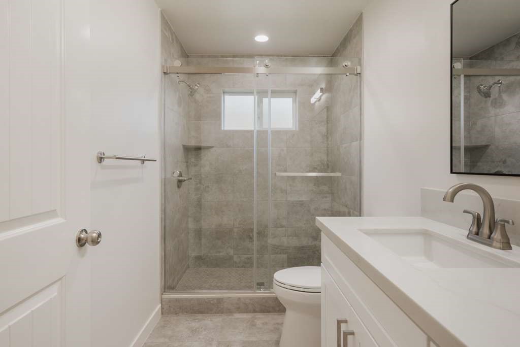 1806 South 8th Street, Unit B Alhambra, CA 91803 - Photo 30 of 44 a bathroom with a sink toilet and shower