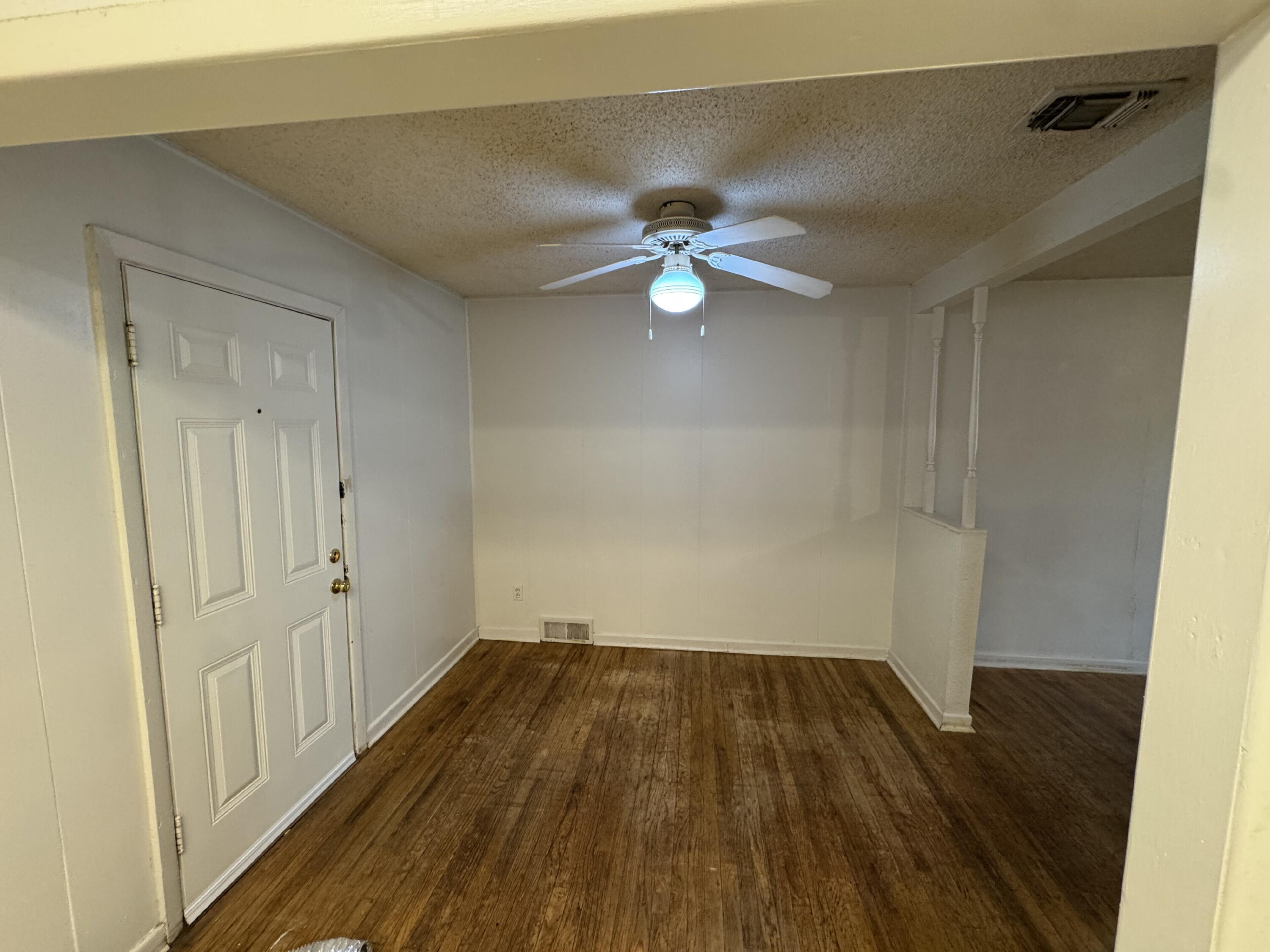 3709 23rd Street Lubbock, TX 79410 - Photo 4 of 8 wooden floor in an empty room