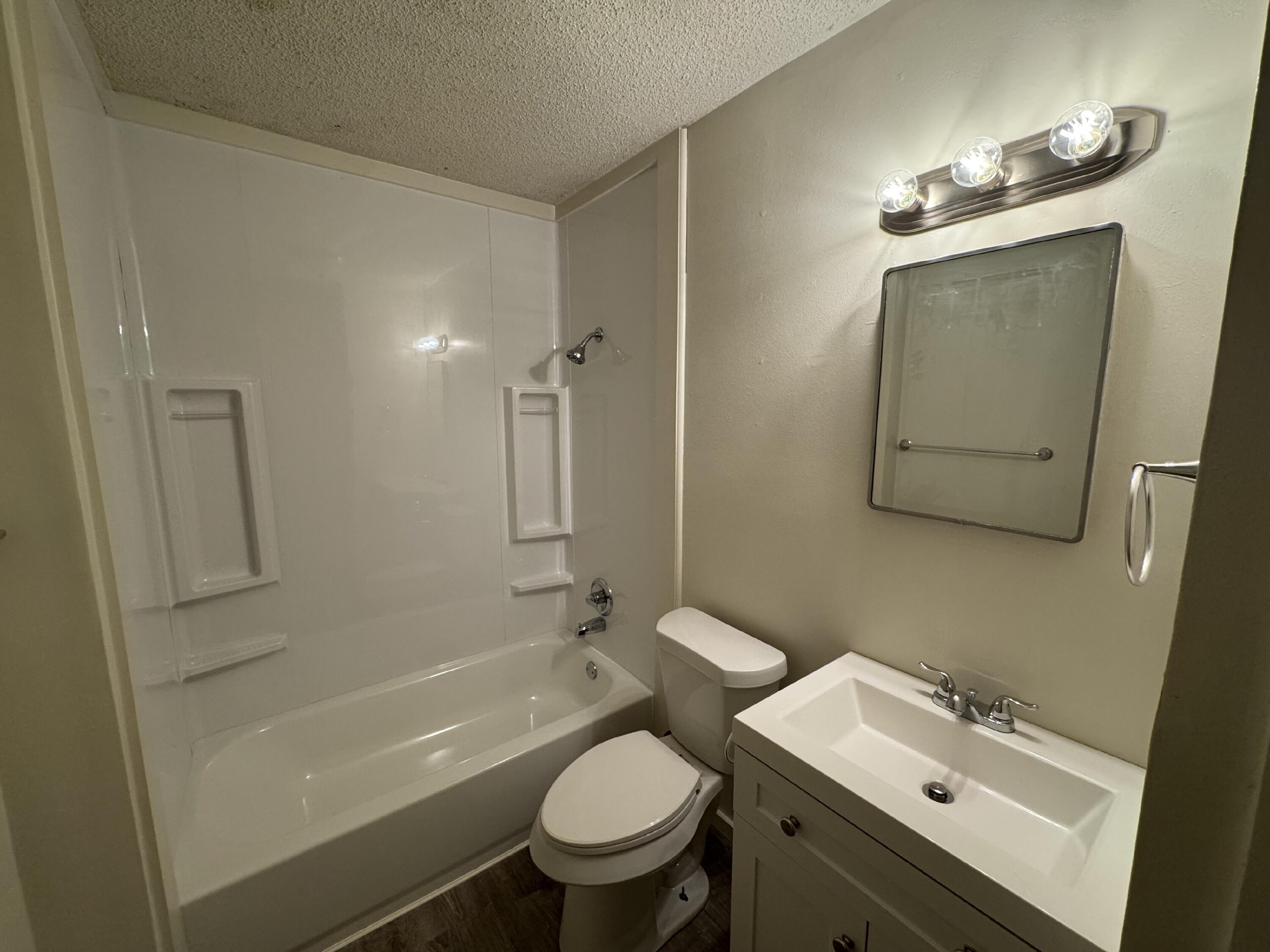 3709 23rd Street Lubbock, TX 79410 - Photo 6 of 8 a bathroom with a sink a toilet and shower