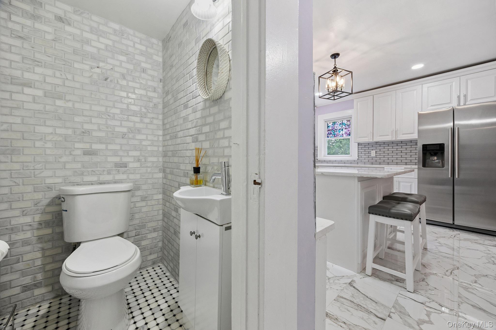 1235 Post Road Scarsdale, NY 10583 - Photo 14 of 30 Half bath with a chandelier, vanity, and recessed lighting
