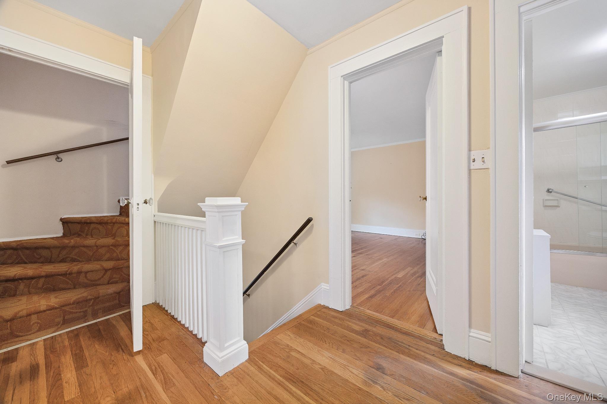 1235 Post Road Scarsdale, NY 10583 - Photo 16 of 30 Stairway with wood finished floors and lofted ceiling