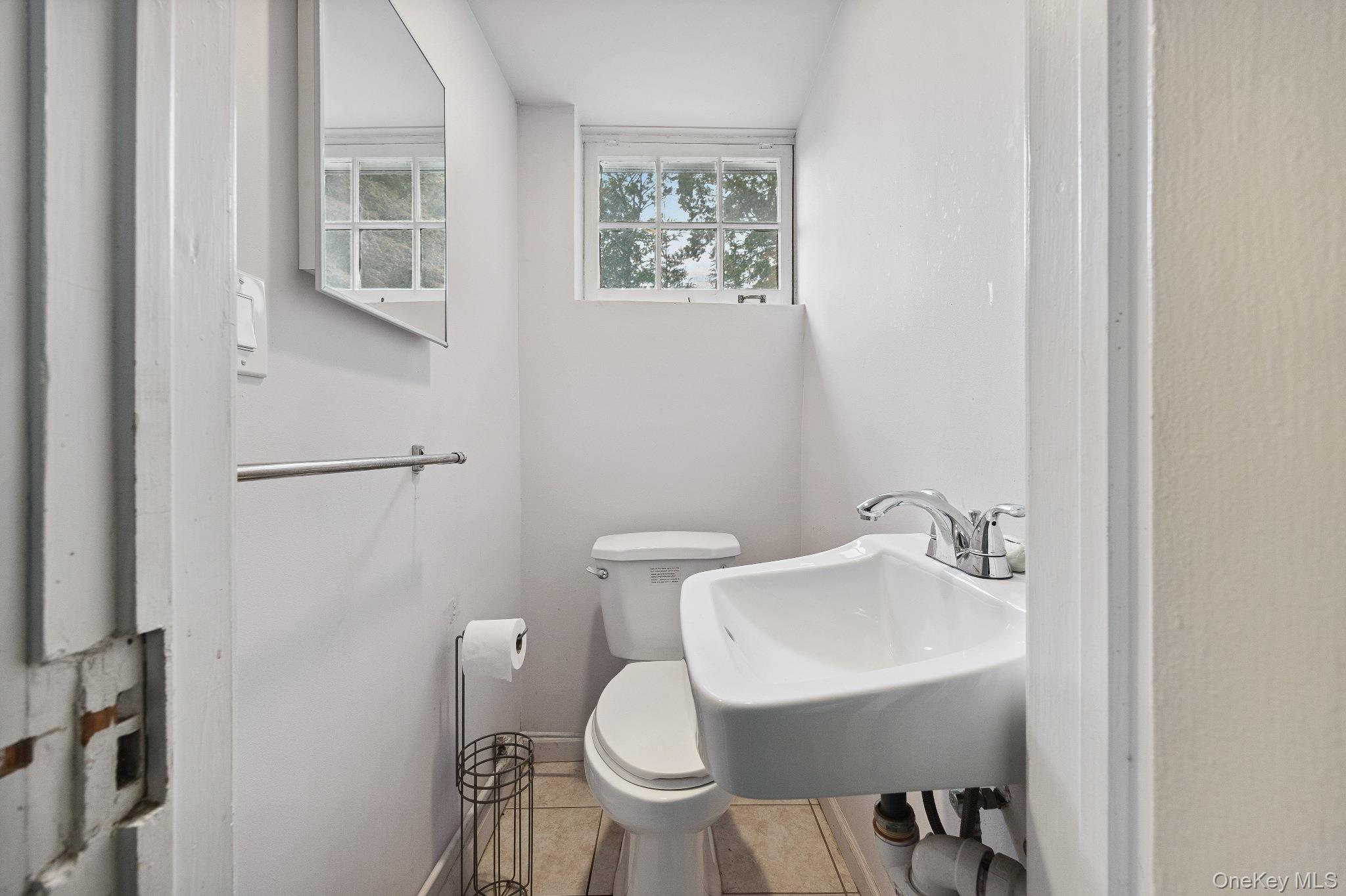1235 Post Road Scarsdale, NY 10583 - Photo 27 of 30 Half bathroom featuring toilet and tile patterned floors