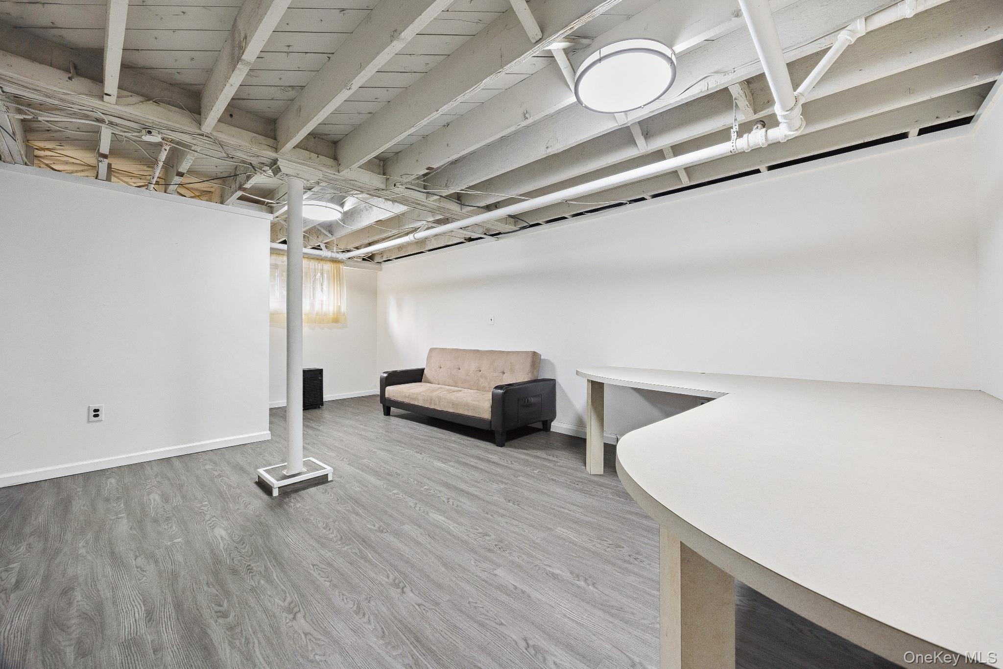 1235 Post Road Scarsdale, NY 10583 - Photo 28 of 30 Finished basement featuring wood finished floors and baseboards