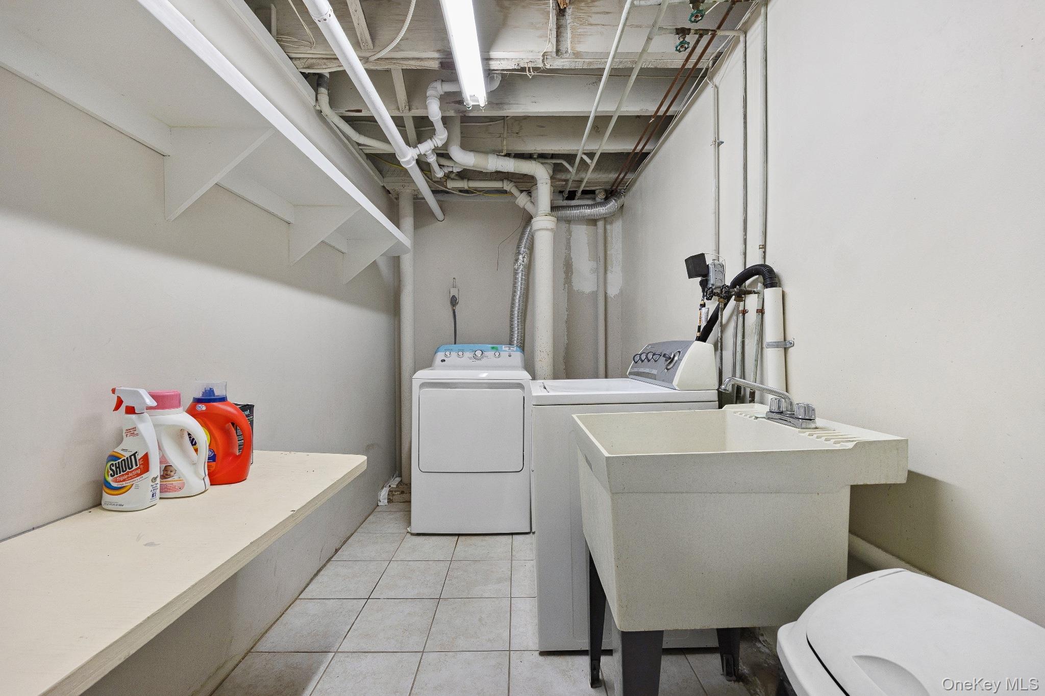 1235 Post Road Scarsdale, NY 10583 - Photo 30 of 30 Washroom featuring independent washer and dryer and light tile patterned floors