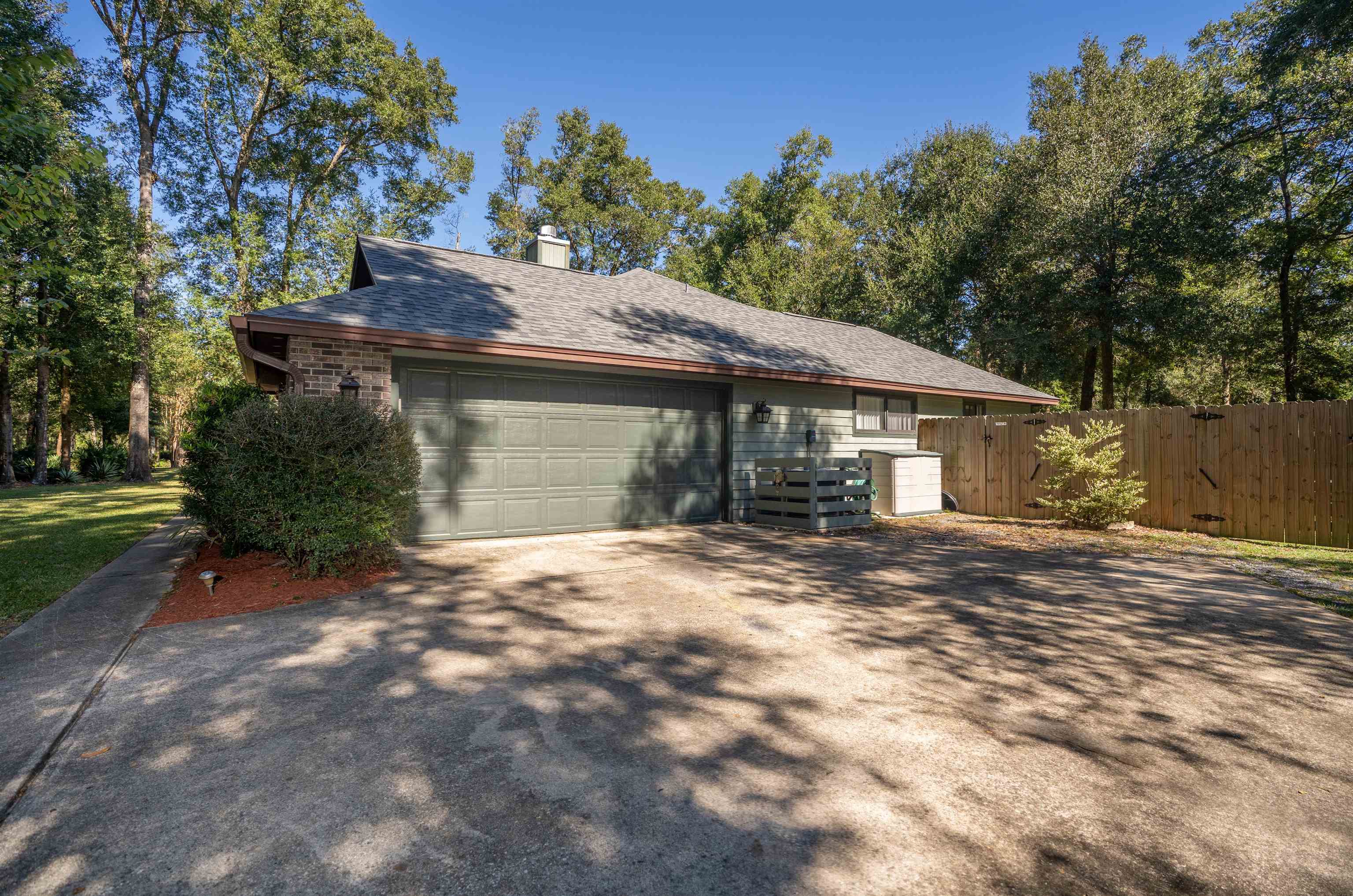 4260 Wicks Branch Road St. Augustine, FL 32086 - Photo 2 of 31 a front view of a house with a garden