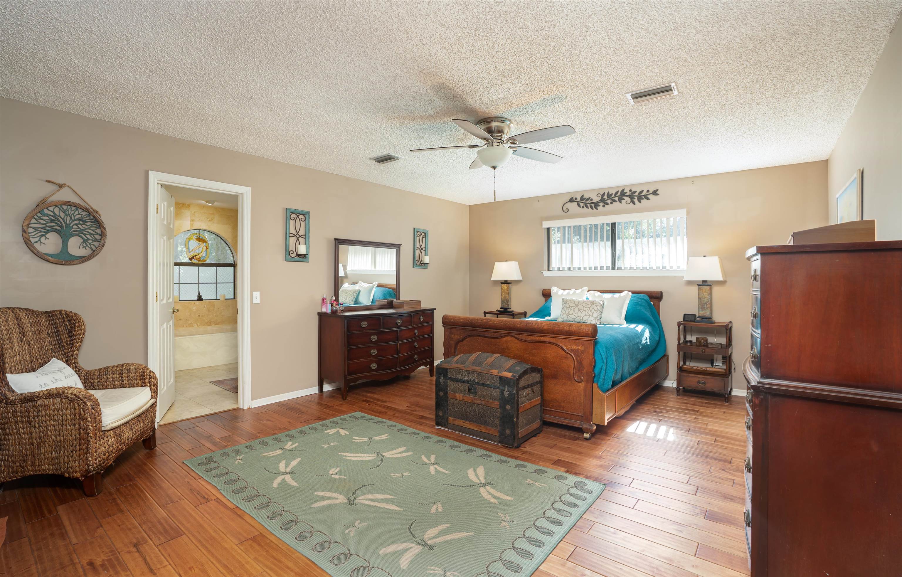 4260 Wicks Branch Road St. Augustine, FL 32086 - Photo 16 of 31 a bedroom with a bed and a couch