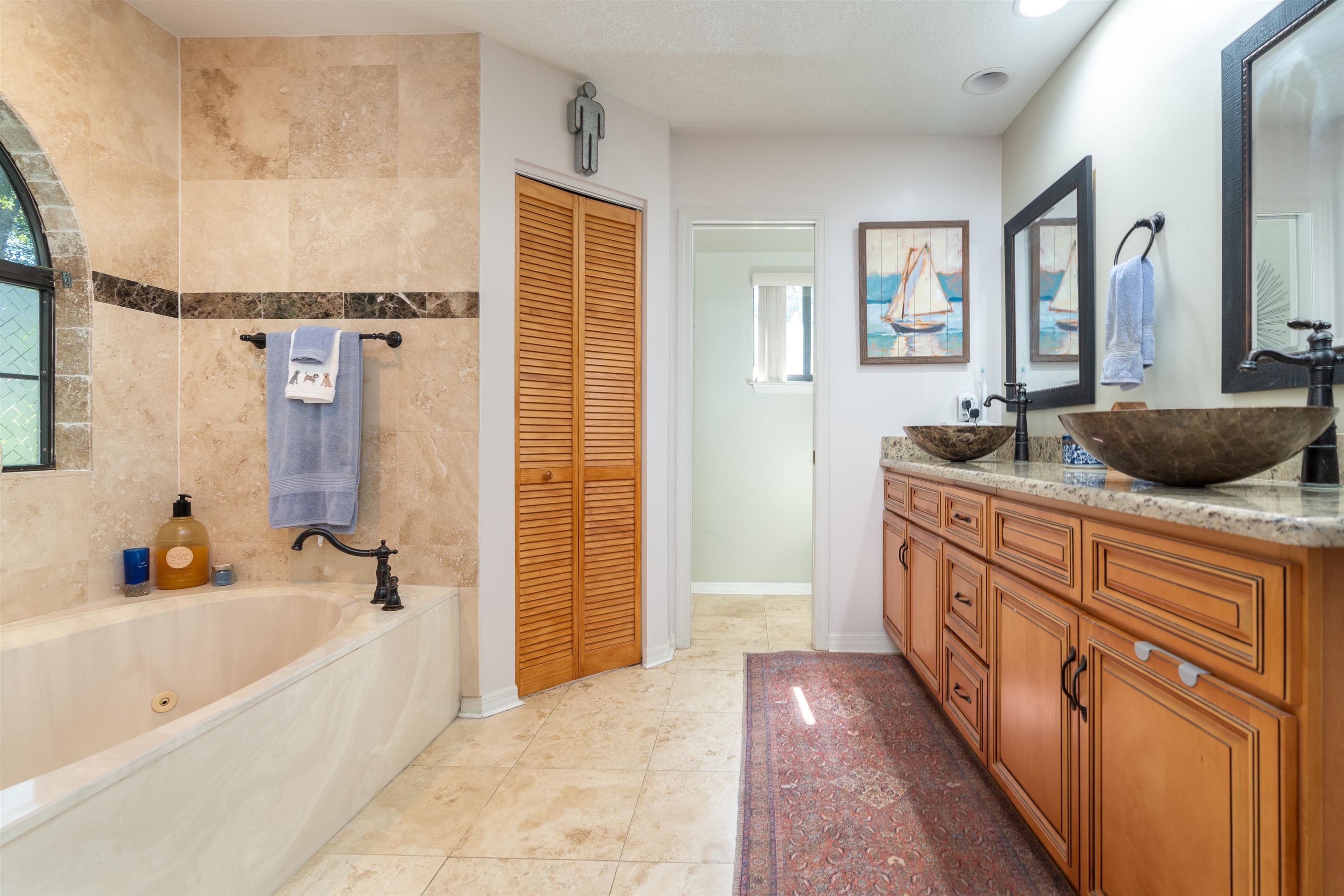 4260 Wicks Branch Road St. Augustine, FL 32086 - Photo 20 of 31 a bathroom with a granite countertop tub sink a mirror a shower and vanity