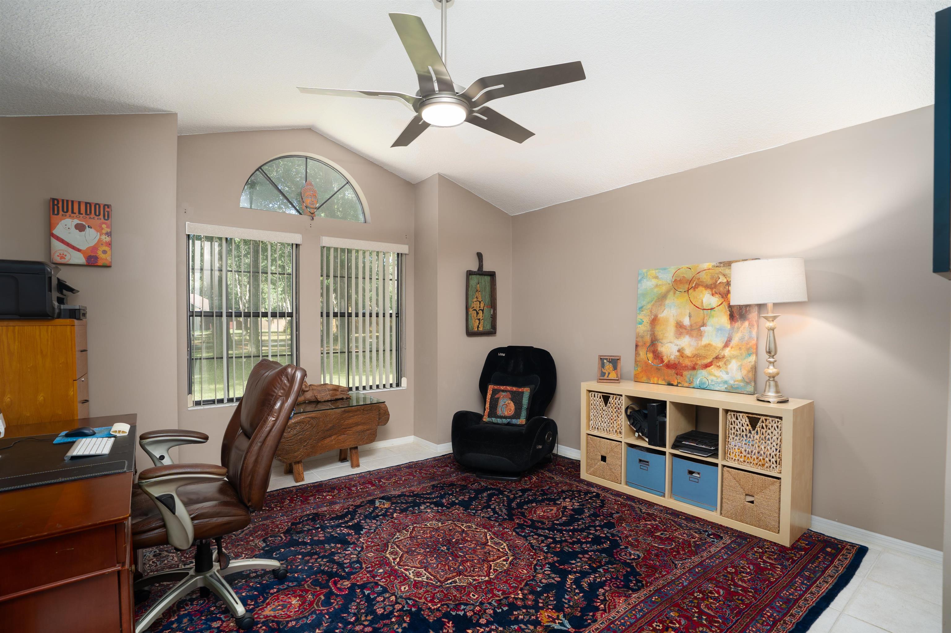 4260 Wicks Branch Road St. Augustine, FL 32086 - Photo 23 of 31 a living room with furniture a flat screen tv and a window