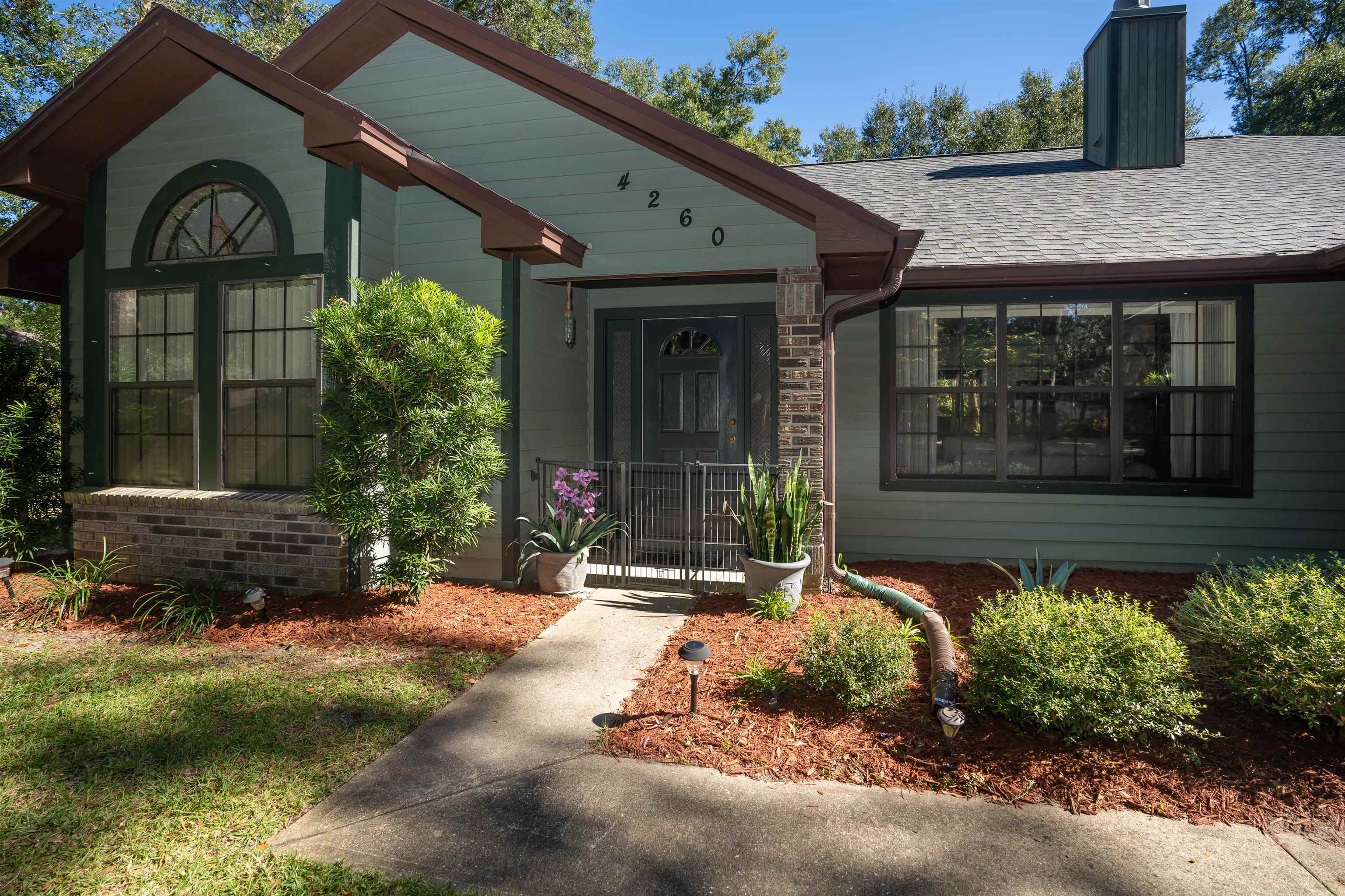 4260 Wicks Branch Road St. Augustine, FL 32086 - Photo 4 of 31 a front view of a house with a yard