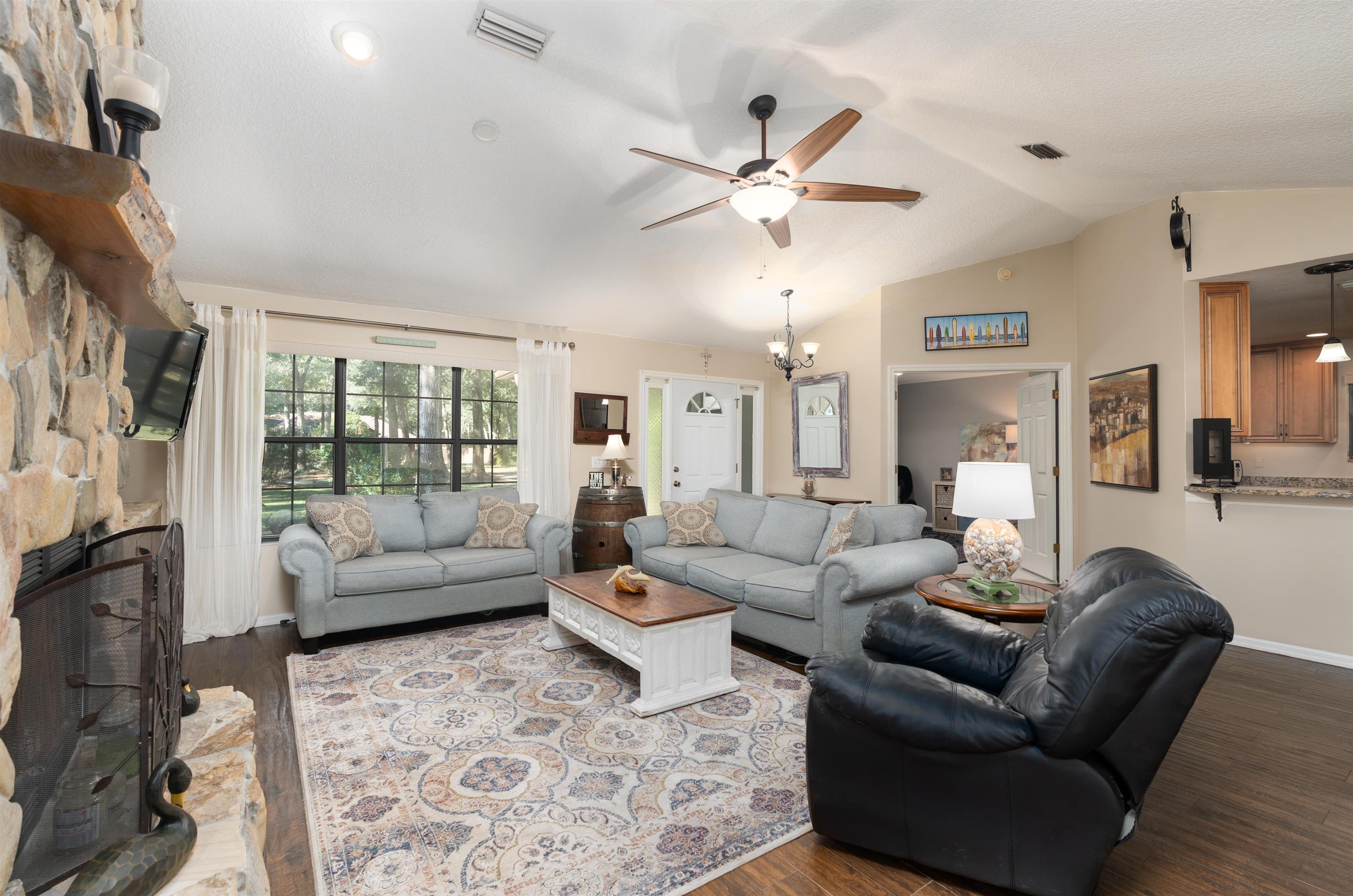 4260 Wicks Branch Road St. Augustine, FL 32086 - Photo 5 of 31 a living room with furniture and a large window