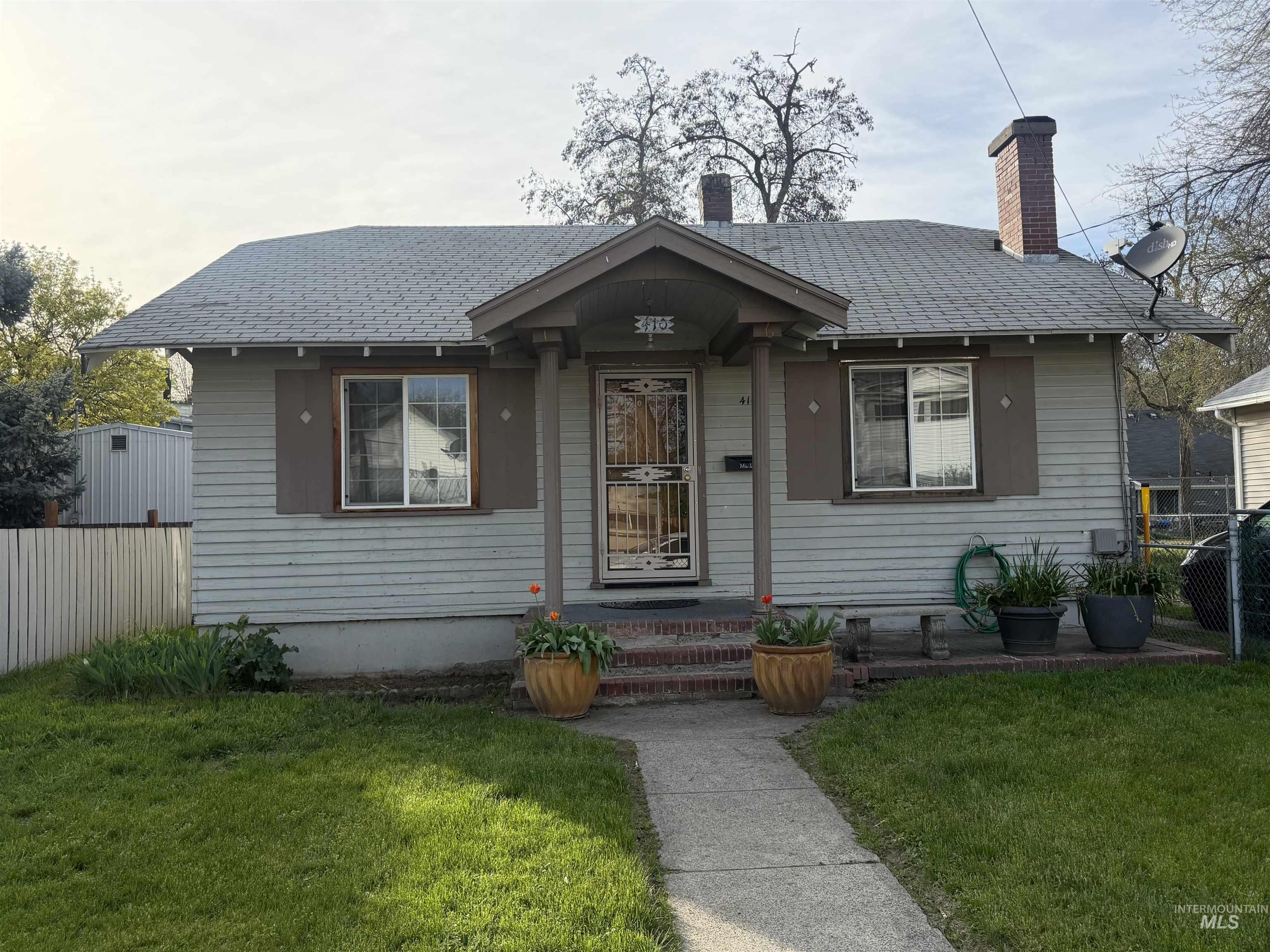 410 12th Street Lewiston, ID 83501 - Photo 1 of 38 Bungalow featuring roof with shingles and a chimney