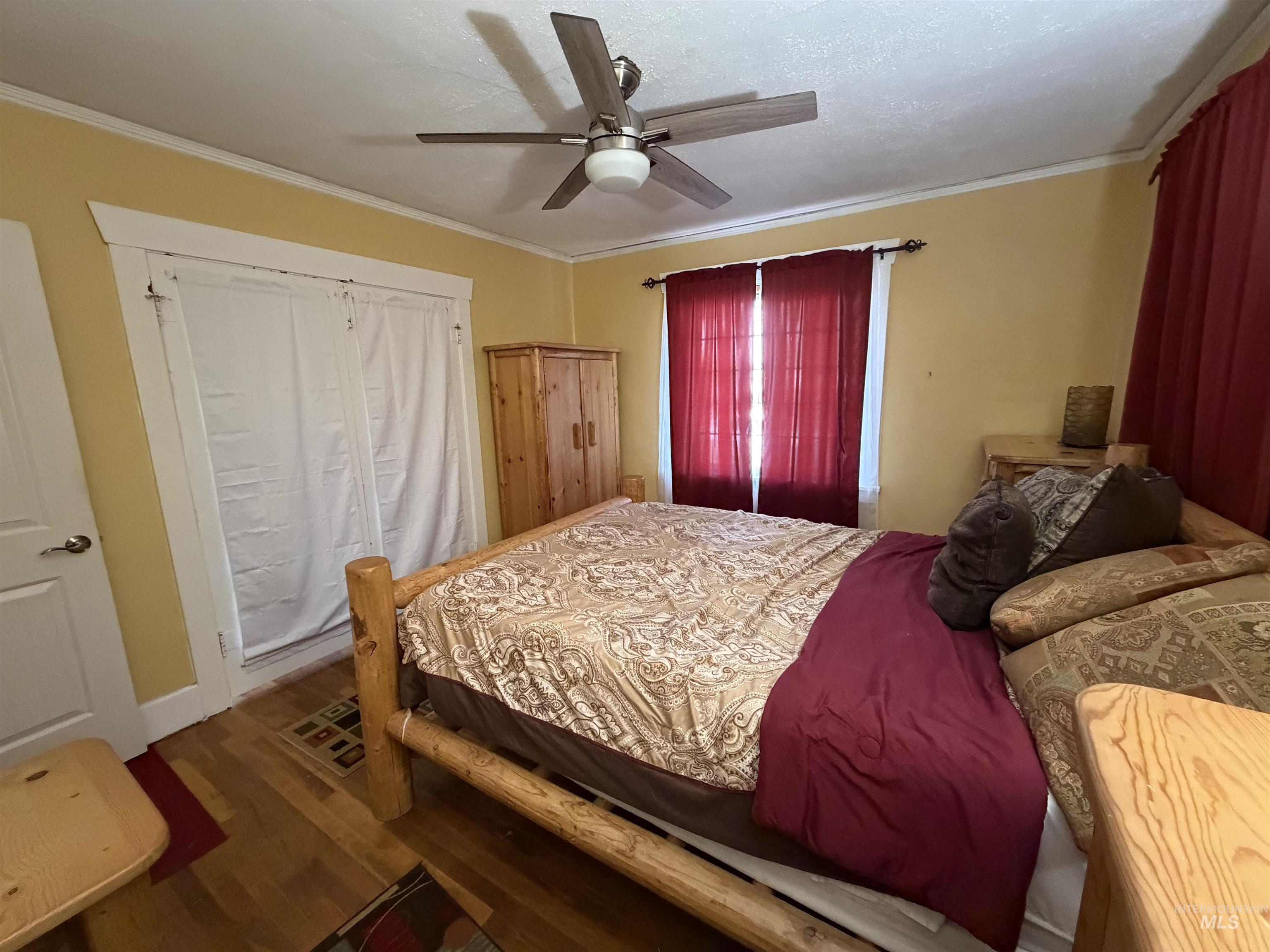 410 12th Street Lewiston, ID 83501 - Photo 13 of 38 Bedroom with wood finished floors, ceiling fan, and crown molding
