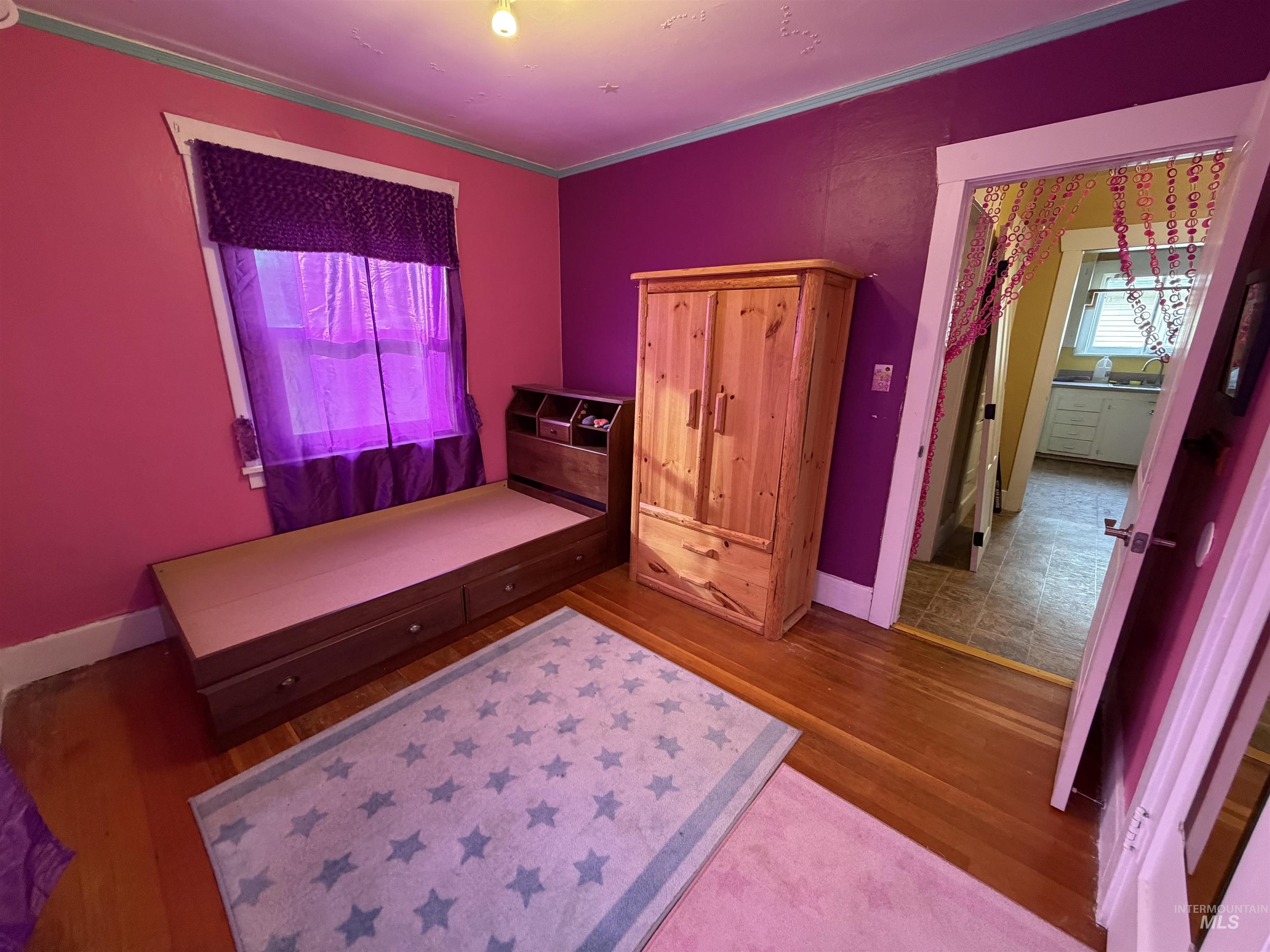 410 12th Street Lewiston, ID 83501 - Photo 16 of 38 Bedroom with wood finished floors and ornamental molding