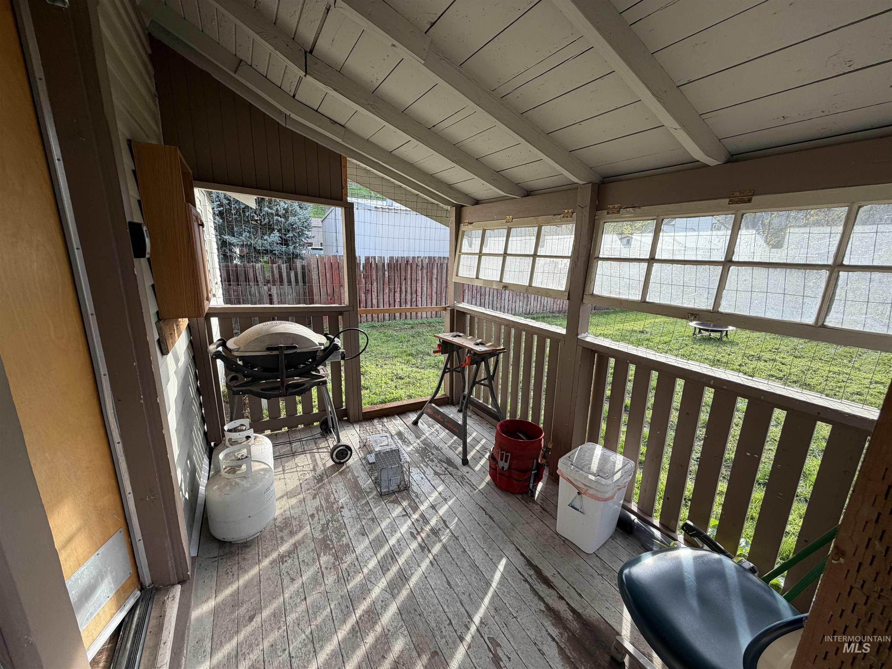 410 12th Street Lewiston, ID 83501 - Photo 31 of 38 Sunroom / solarium featuring vaulted ceiling with beams and a deck