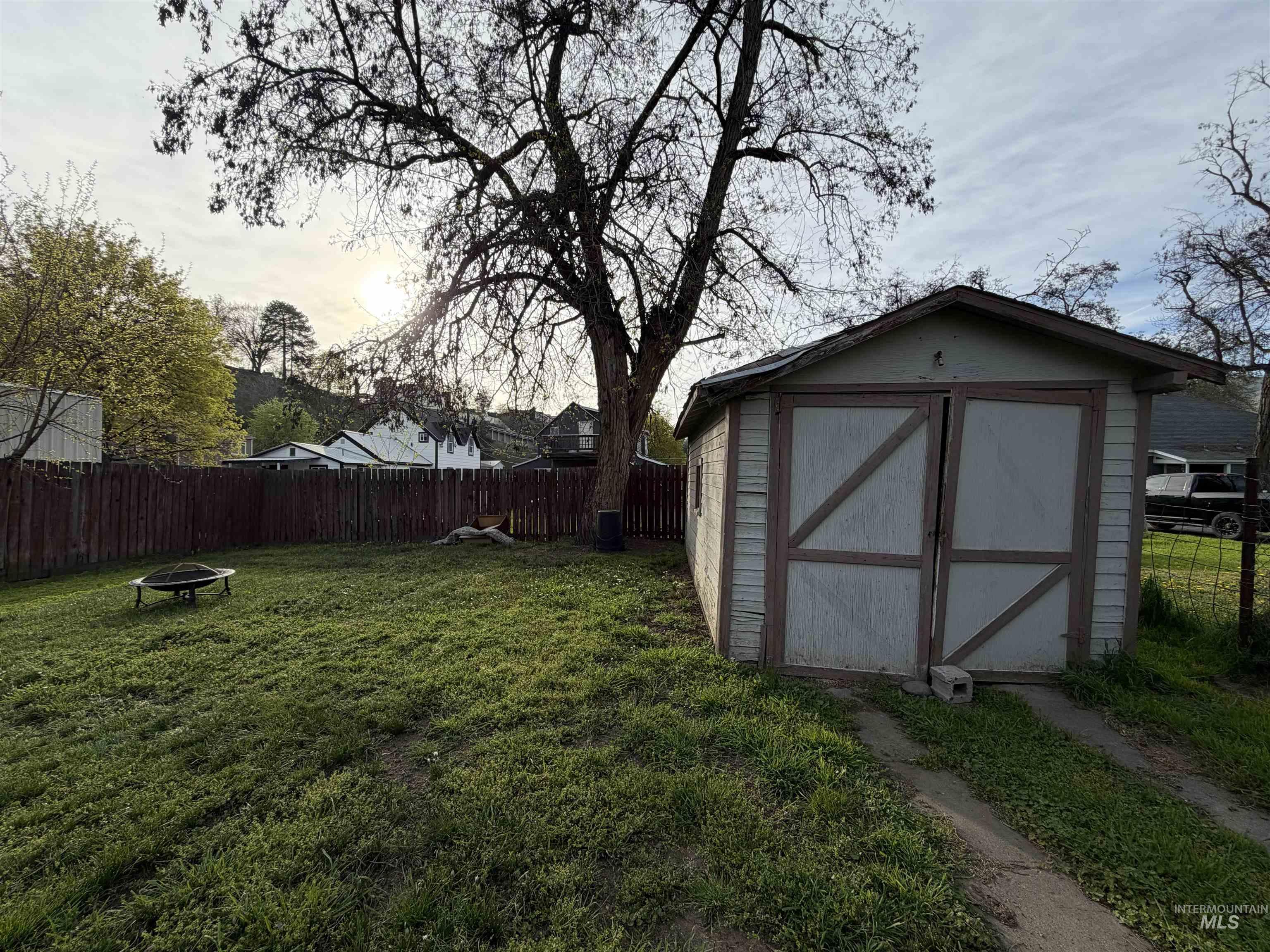 410 12th Street Lewiston, ID 83501 - Photo 35 of 38 View of shed with a fenced backyard and a fire pit