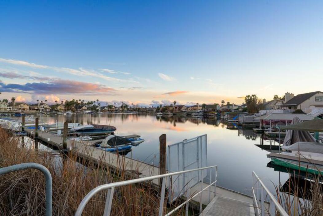 2066 Sand Point Road Discovery Bay, CA 94505 - Photo 35 of 36 a view of a lake with couches chairs