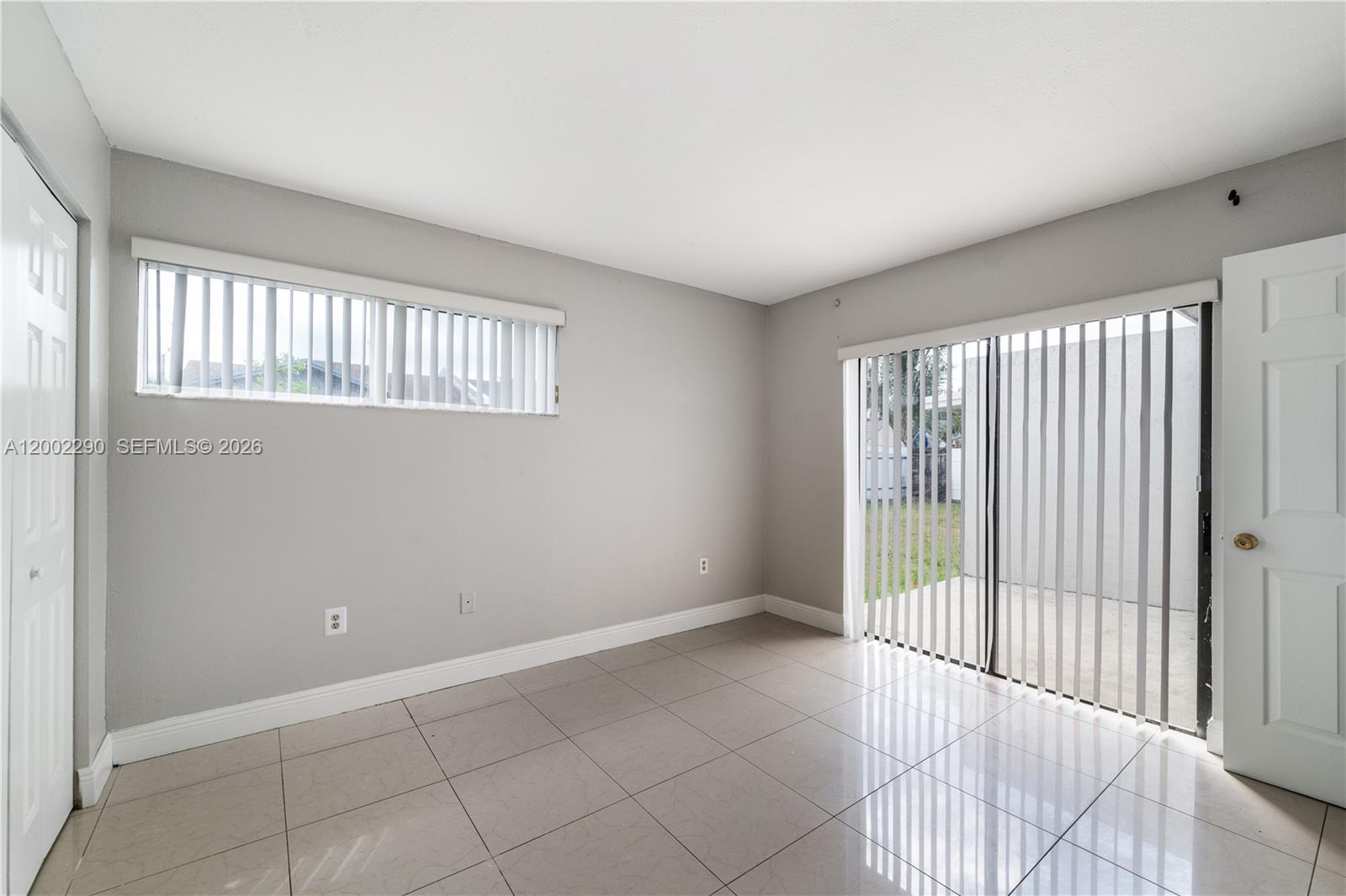 11310 Southwest 189th Street, Unit 11310 Miami, FL 33157 - Photo 12 of 24 a view of an empty room and window