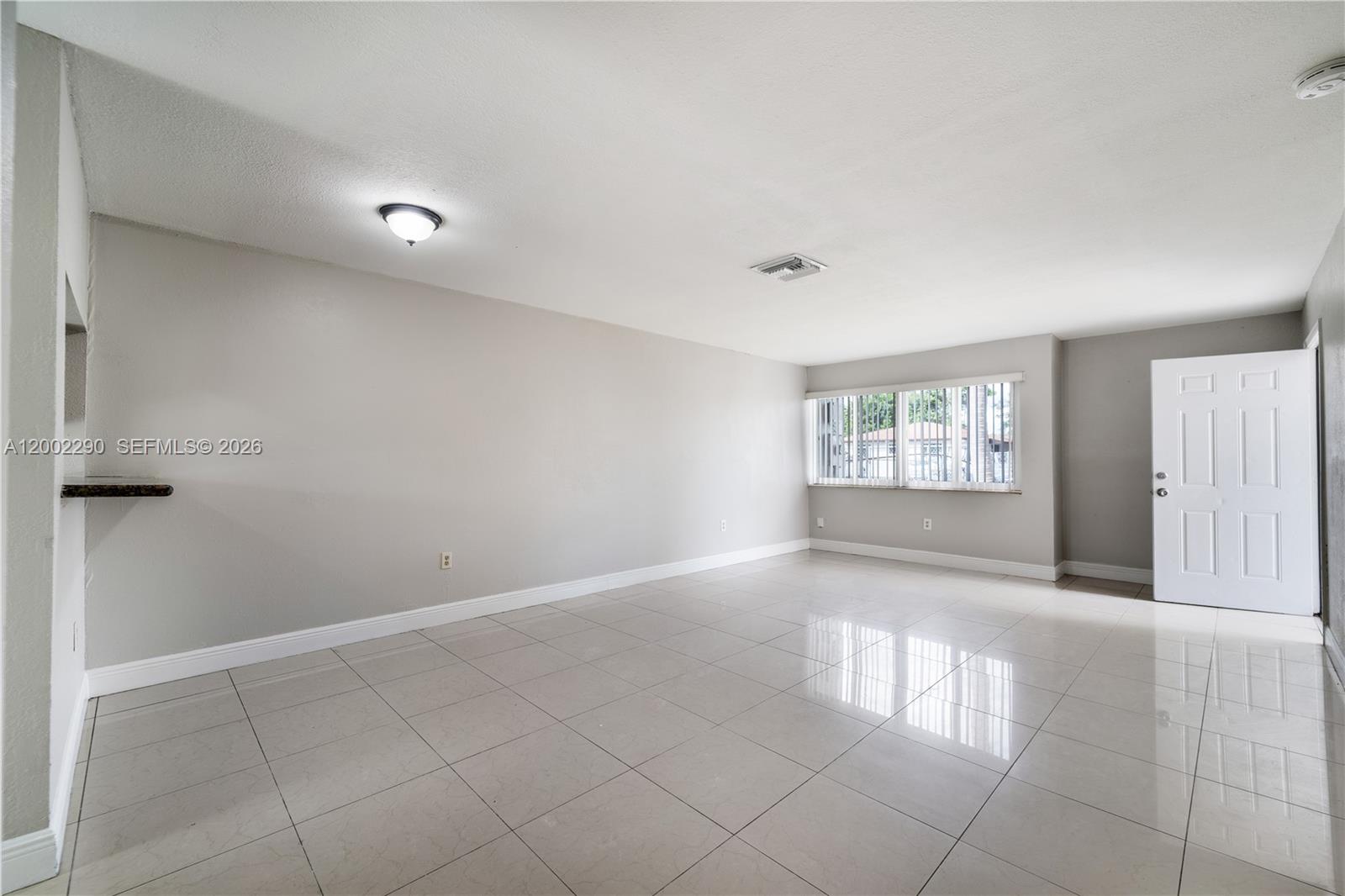 11310 Southwest 189th Street, Unit 11310 Miami, FL 33157 - Photo 15 of 24 an empty room with windows