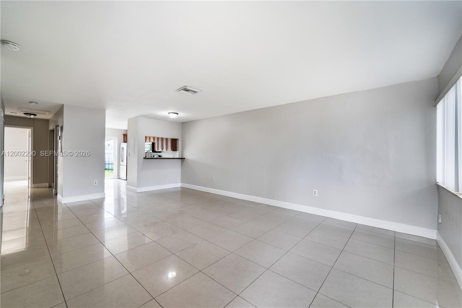 11310 Southwest 189th Street, Unit 11310 Miami, FL 33157 - Photo 17 of 24 a view of a kitchen with a sink and a refrigerator