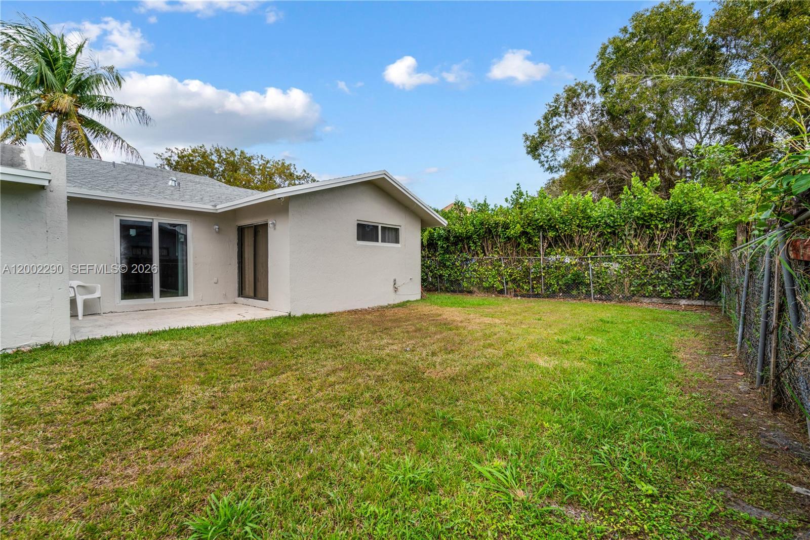 11310 Southwest 189th Street, Unit 11310 Miami, FL 33157 - Photo 19 of 24 a view of a backyard with a garden