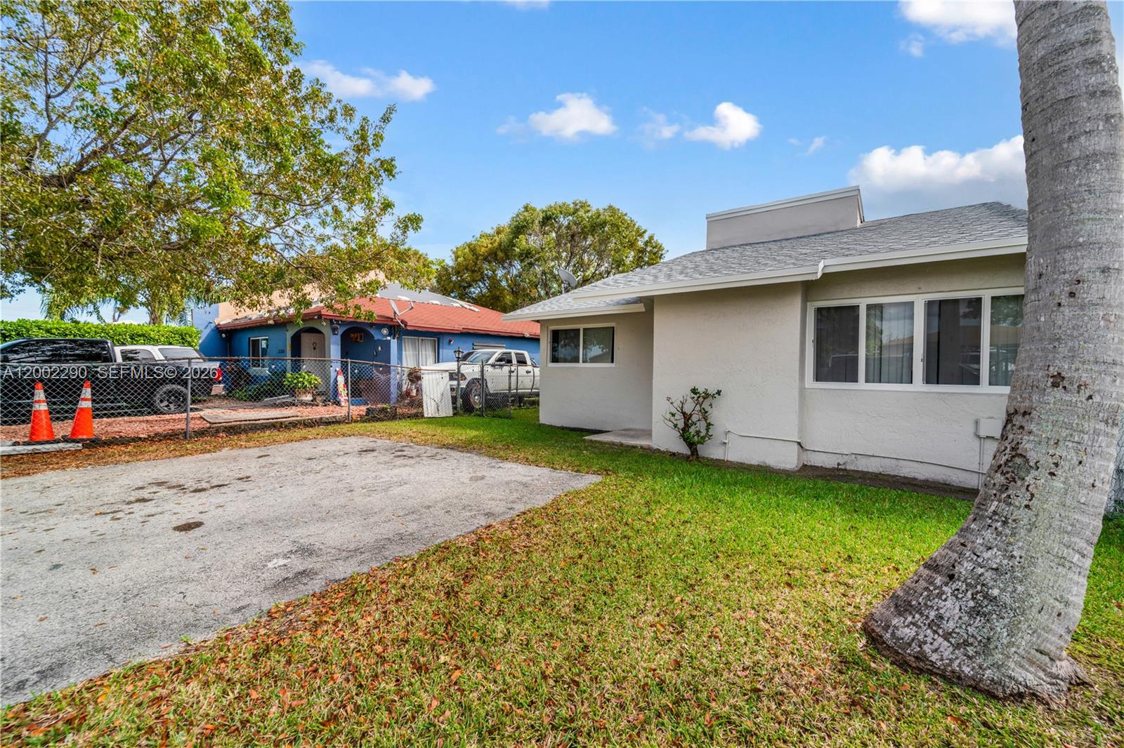 11310 Southwest 189th Street, Unit 11310 Miami, FL 33157 - Photo 23 of 24 a front view of a house with a garden