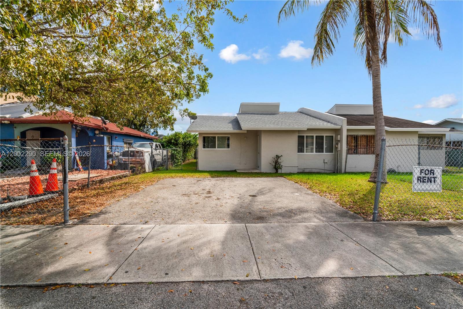 11310 Southwest 189th Street, Unit 11310 Miami, FL 33157 - Photo 24 of 24 a front view of a house with garden