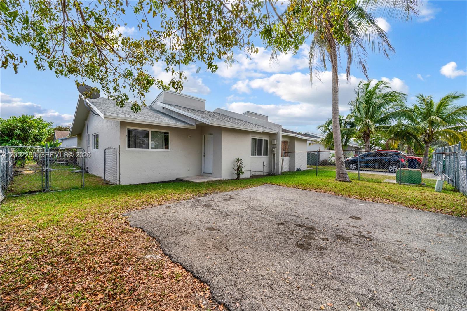 11310 Southwest 189th Street, Unit 11310 Miami, FL 33157 - Photo 4 of 24 a view of outdoor space yard and house