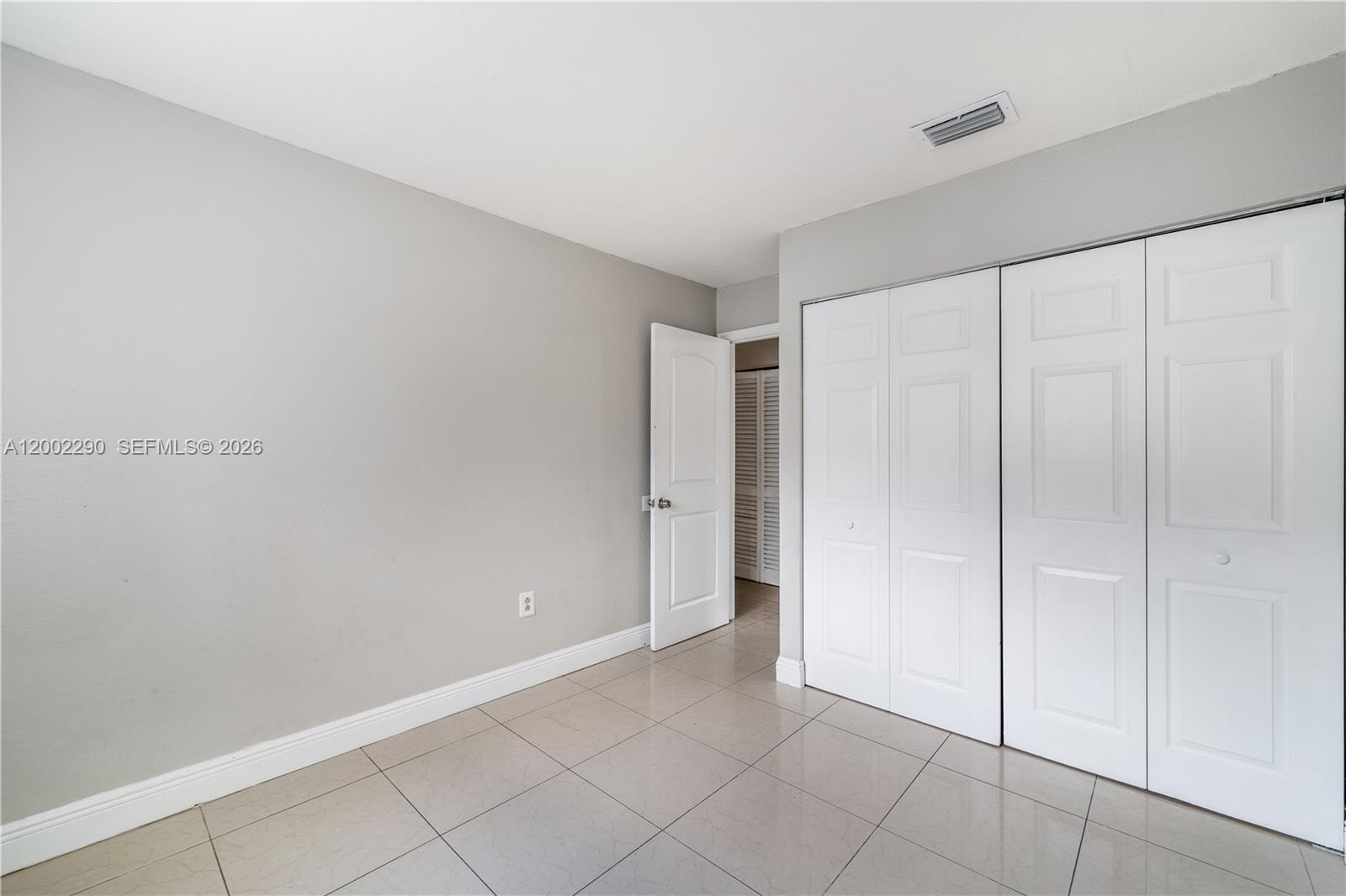11310 Southwest 189th Street, Unit 11310 Miami, FL 33157 - Photo 9 of 24 a view of an empty room