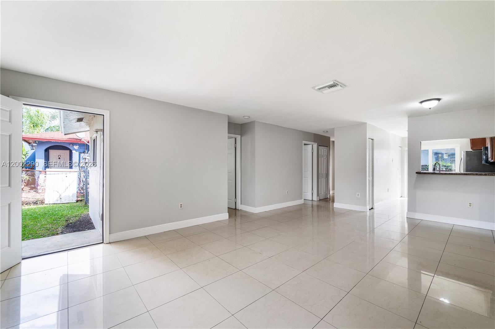 11310 Southwest 189th Street, Unit 11310 Miami, FL 33157 - Photo 10 of 24 a view of an empty room with a window