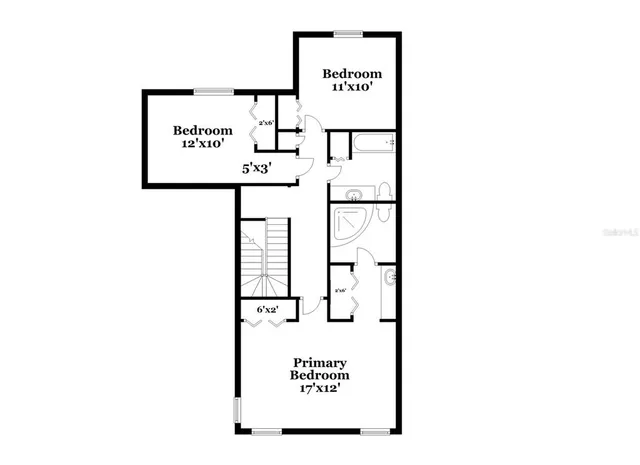 a view of a bench in front of a wall