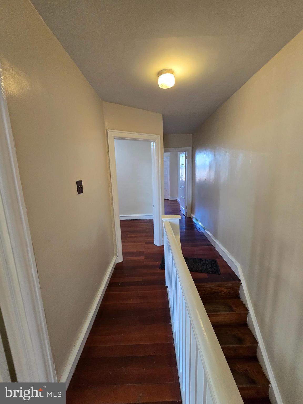 5215 North Tabor Road Philadelphia, PA 19124 - Photo 13 of 14 a view of a hallway with wooden floor and stairs