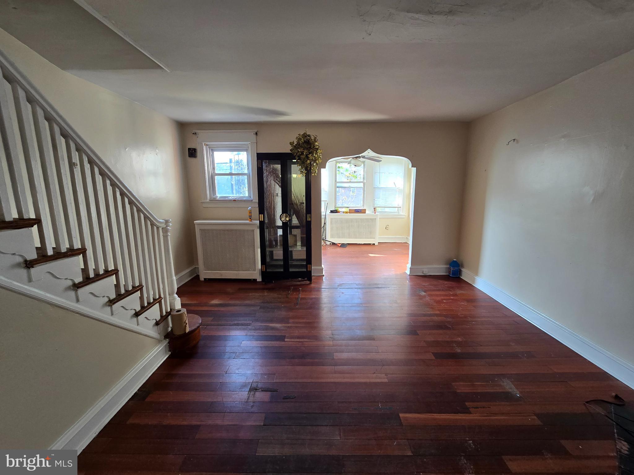 5215 North Tabor Road Philadelphia, PA 19124 - Photo 6 of 14 a view of empty room with wooden floor and fan