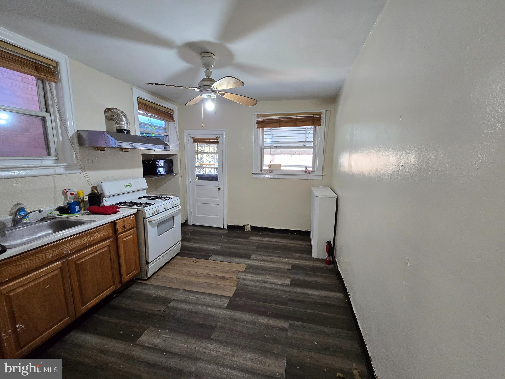 5215 North Tabor Road Philadelphia, PA 19124 - Photo 7 of 14 a kitchen with stainless steel appliances granite countertop lots of counter top space