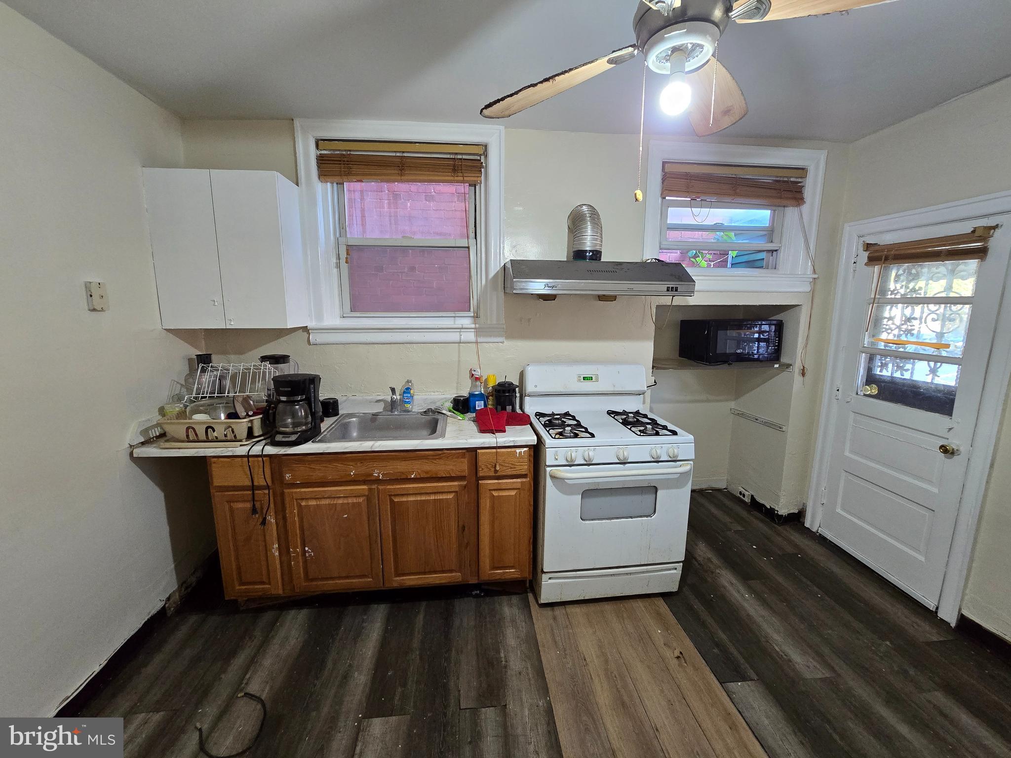 5215 North Tabor Road Philadelphia, PA 19124 - Photo 8 of 14 a kitchen with cabinets a sink and appliances
