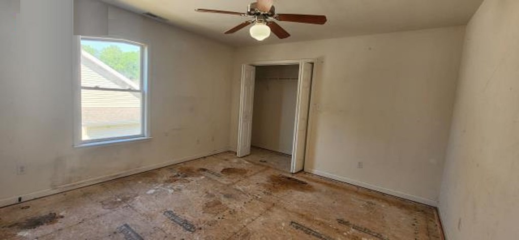 2402 Octopus Road Greenbackville, VA 23356 - Photo 8 of 21 an empty room with a window and a fan