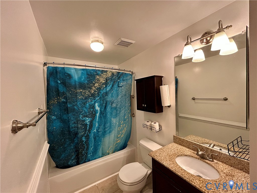 3063 Montfort Loop Henrico, VA 23294 - Photo 17 of 22 a bathroom with a sink a toilet and shower
