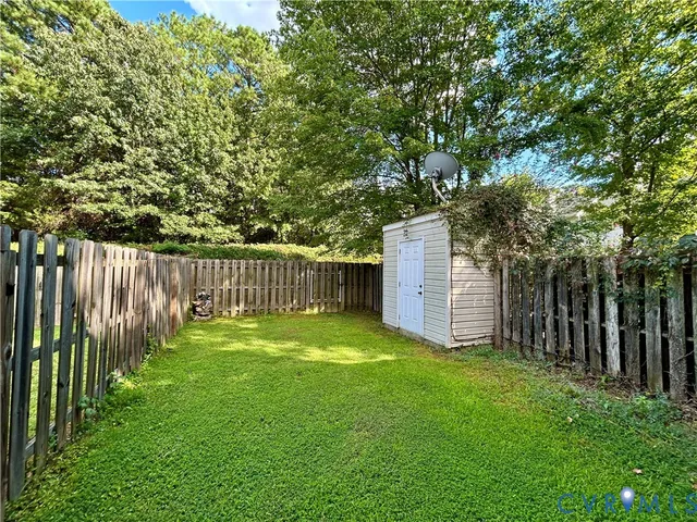 a view of a backyard with a small cabin