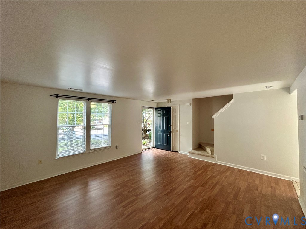 3063 Montfort Loop Henrico, VA 23294 - Photo 6 of 22 an empty room with wooden floor and windows