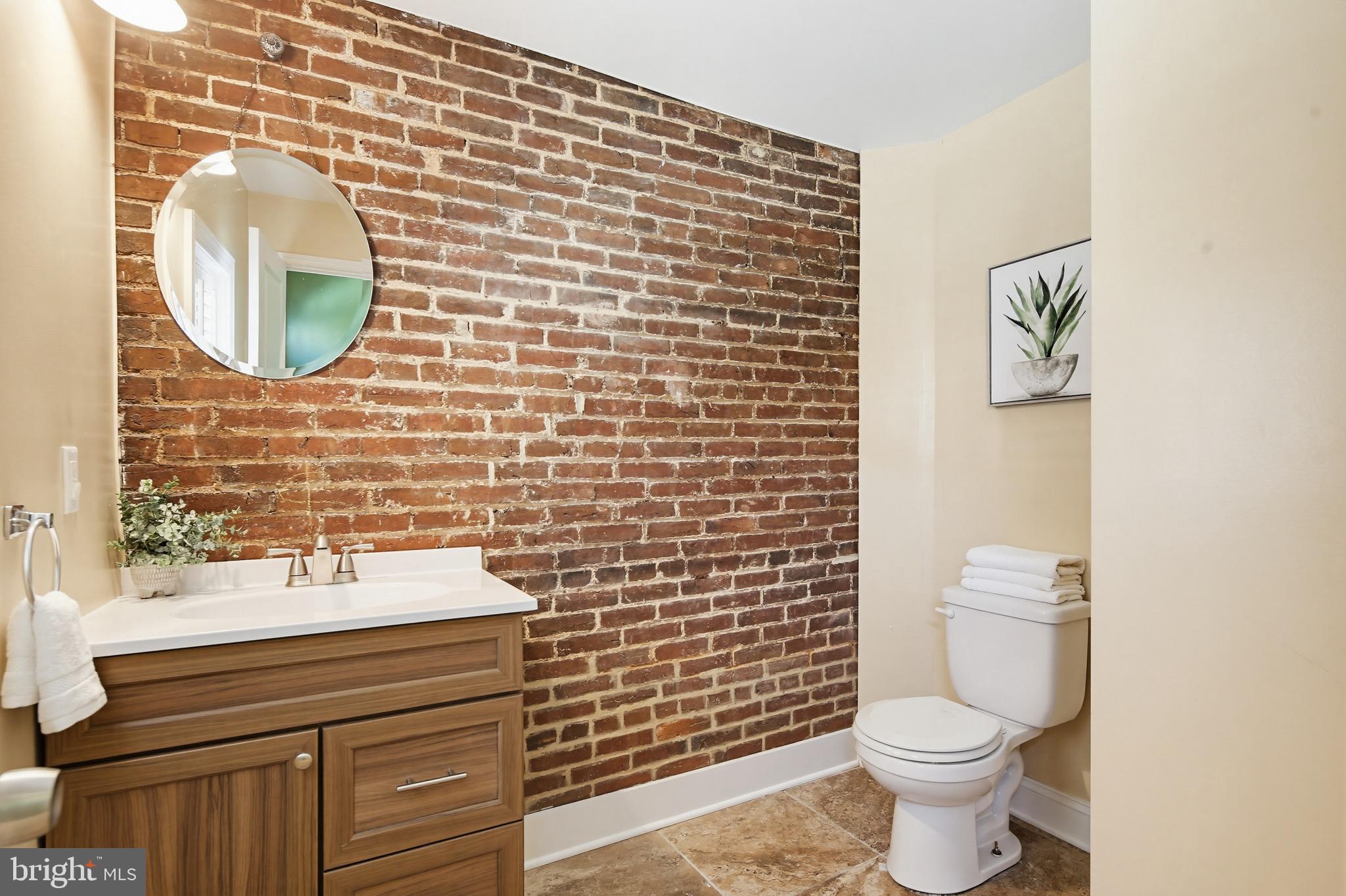 122 West Clement Street Baltimore, MD 21230 - Photo 12 of 40 a bathroom with a toilet and a sink