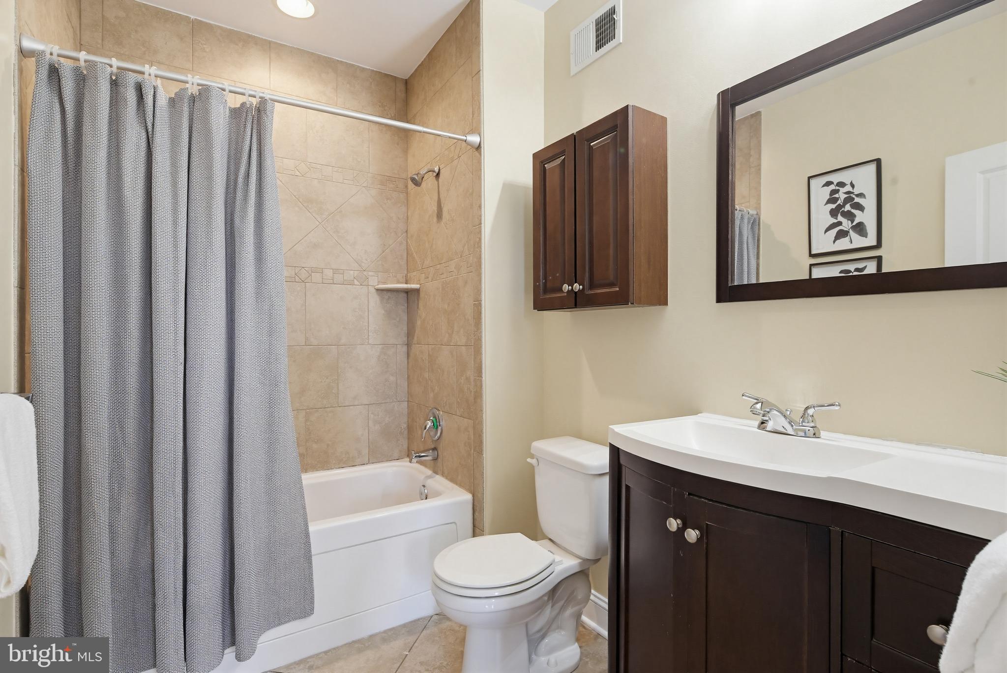 122 West Clement Street Baltimore, MD 21230 - Photo 17 of 40 a bathroom with a sink toilet and shower