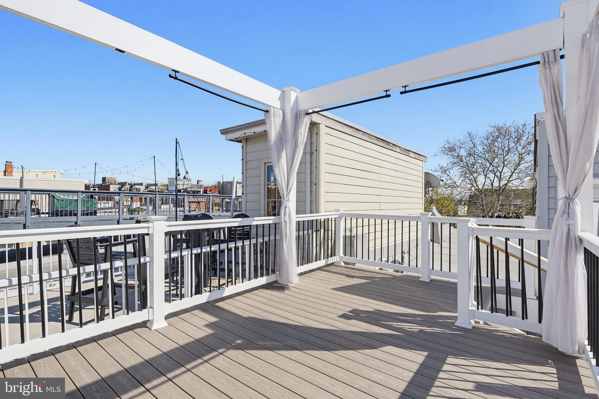 122 West Clement Street Baltimore, MD 21230 - Photo 24 of 40 a view of a balcony with wooden floor