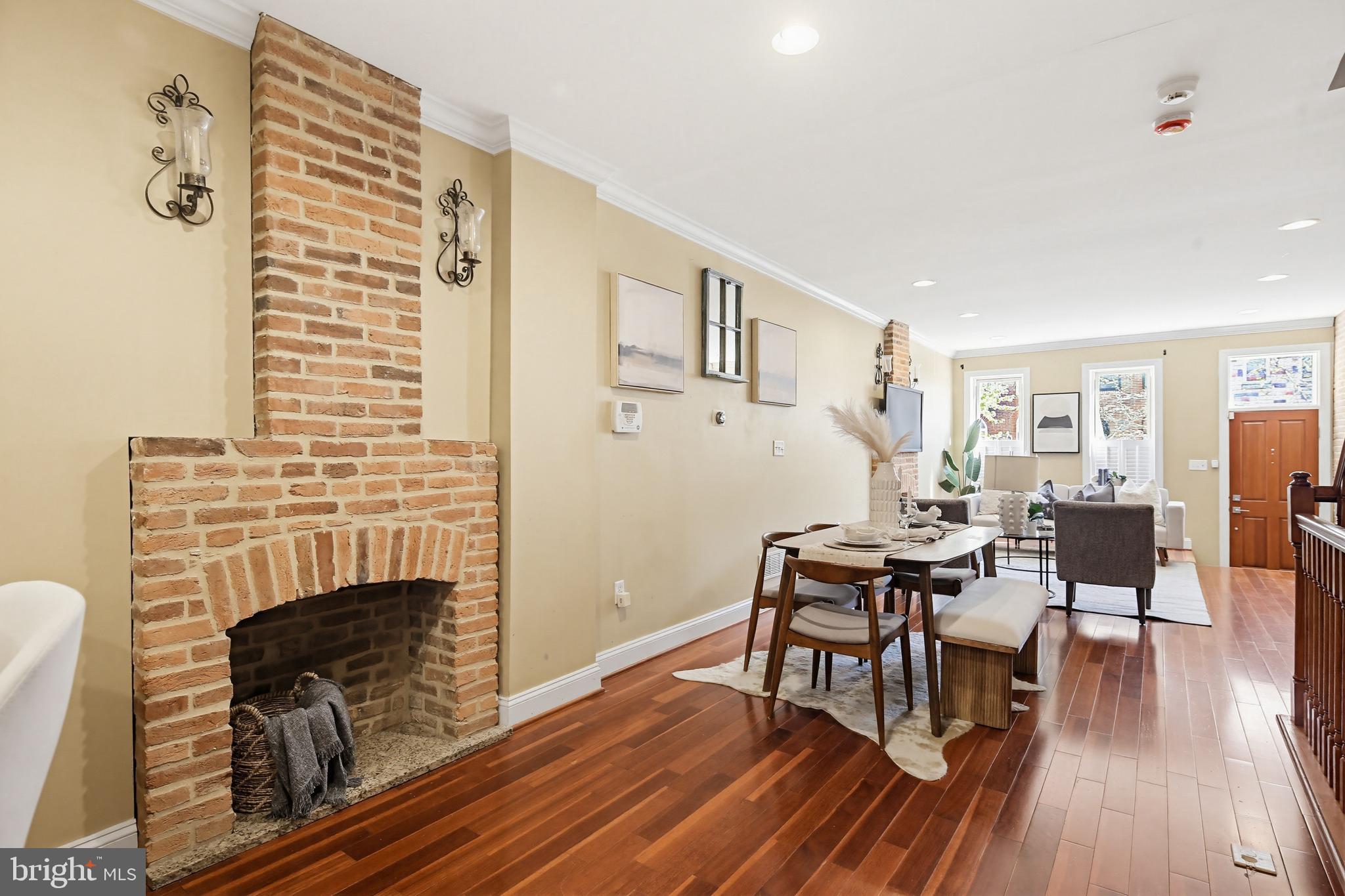 122 West Clement Street Baltimore, MD 21230 - Photo 10 of 40 a living room with furniture a fireplace and wooden floor