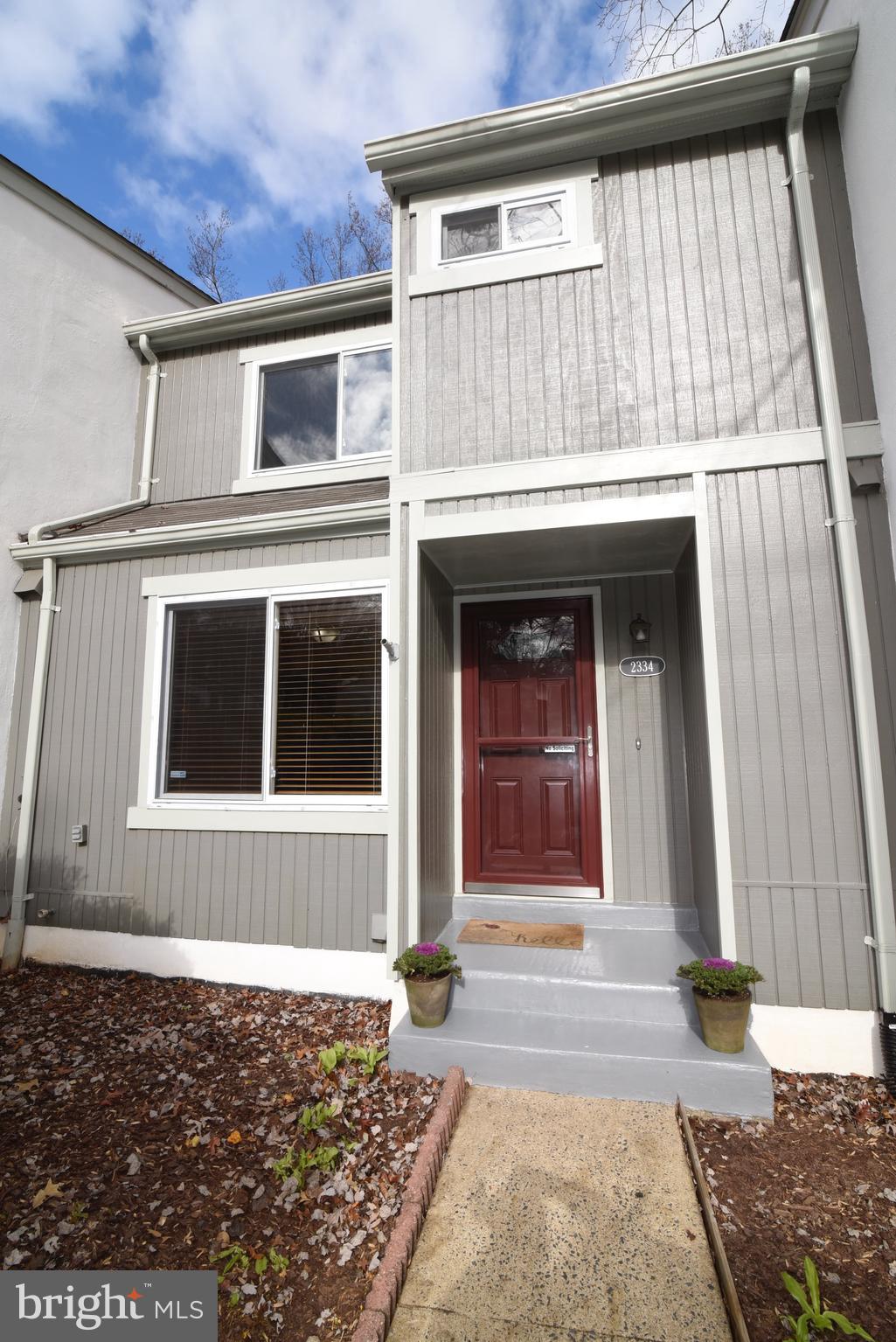 2334 Generation Drive Reston, VA 20191 - Photo 1 of 55 a front view of a house with a garage