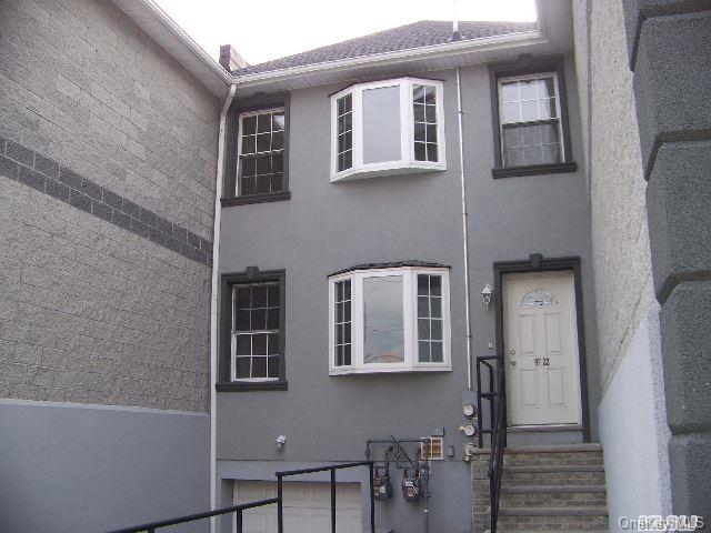 97-22 Albert Road Queens, NY 11417 - Photo 1 of 1 a front view of a house with a window