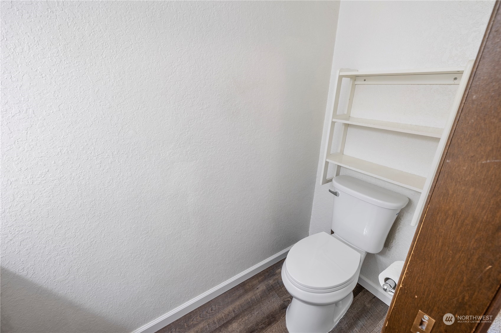120 124th Street Southwest, Unit F2 Everett, WA 98204 - Photo 11 of 19 a white toilet sitting next to a white cabinet