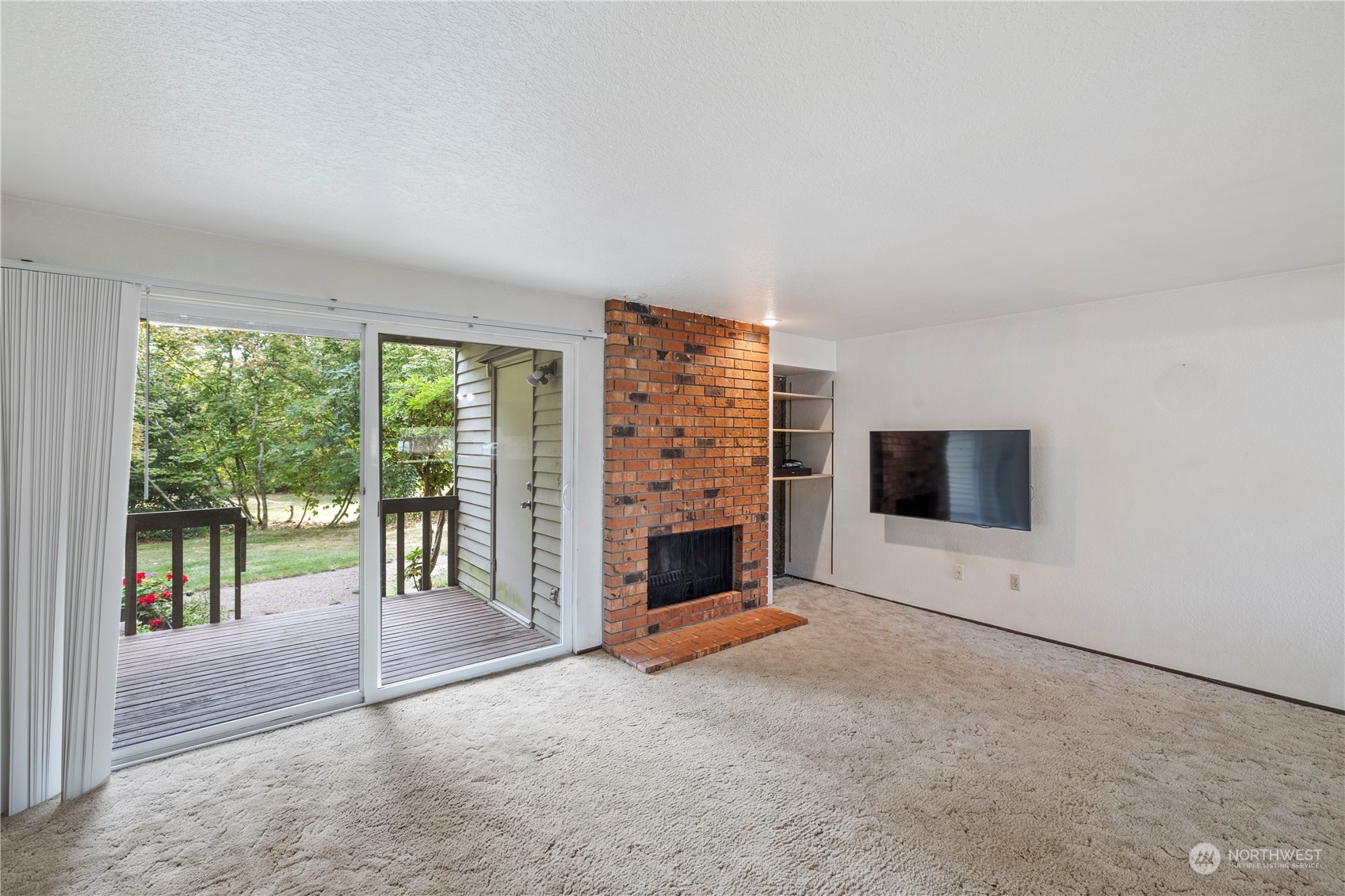 120 124th Street Southwest, Unit F2 Everett, WA 98204 - Photo 6 of 19 a view of an empty room with fireplace and a window