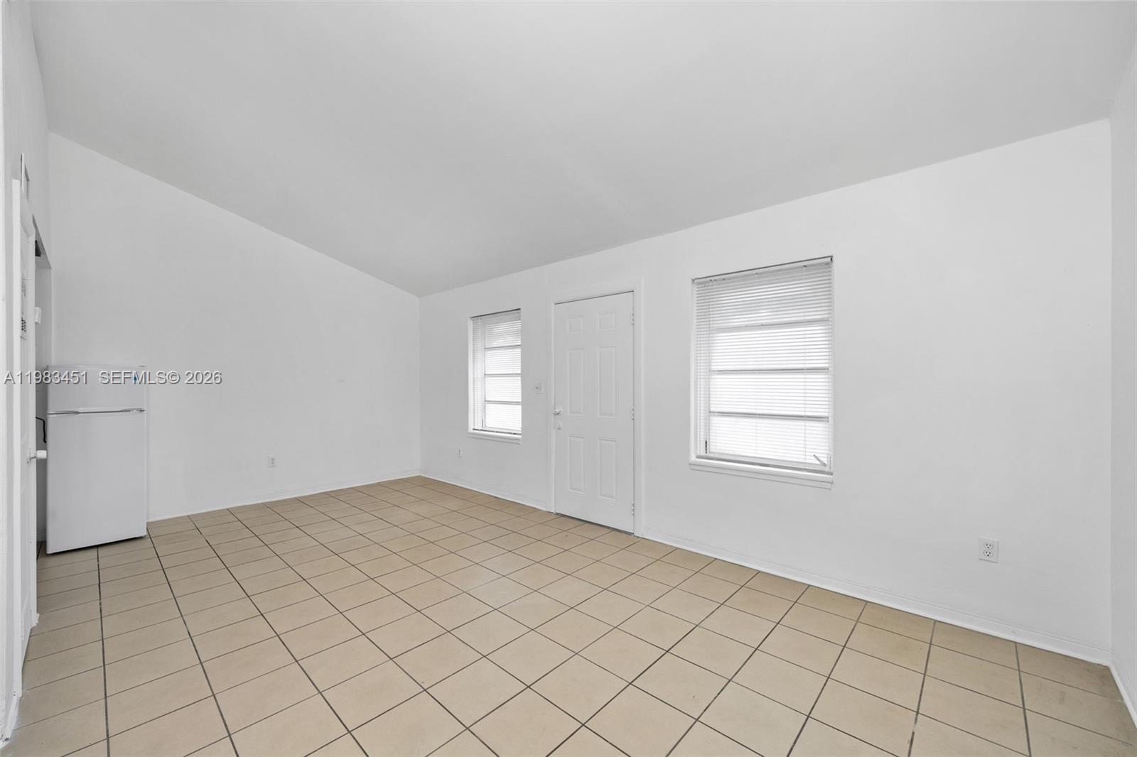 840 Southwest 7th Street, Unit 850 Miami, FL 33130 - Photo 6 of 12 an empty room with windows