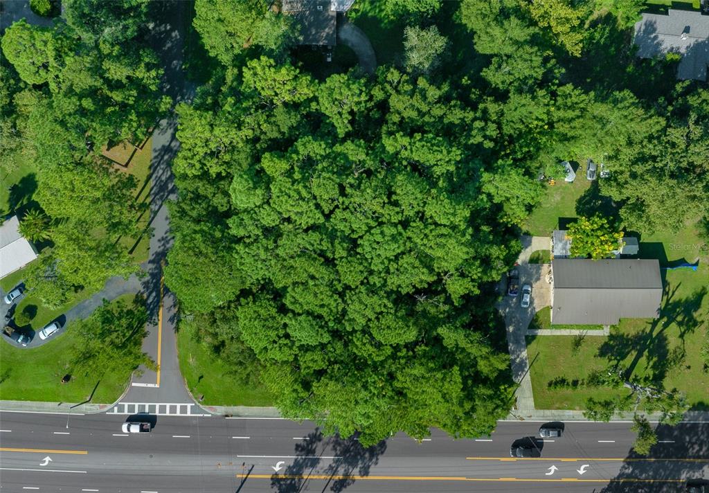 0 Southeast 15th Street Ocala, FL 34471 - Photo 16 of 22 an aerial view of a house with a yard and garden view