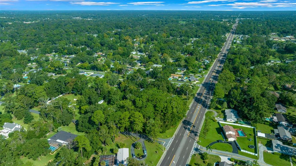 0 Southeast 15th Street Ocala, FL 34471 - Photo 20 of 22 a view of a yard with plants and large trees